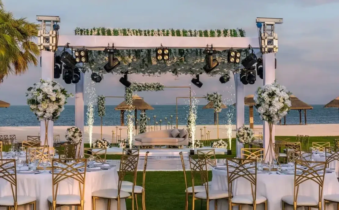 Elegant beachfront wedding in Abu Dhabi at Al Maya island resort with floral decor and ocean views