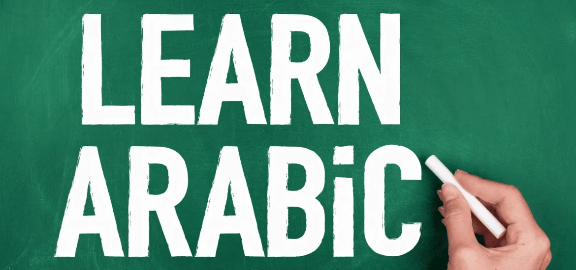 A board that says "Learning Arabic."