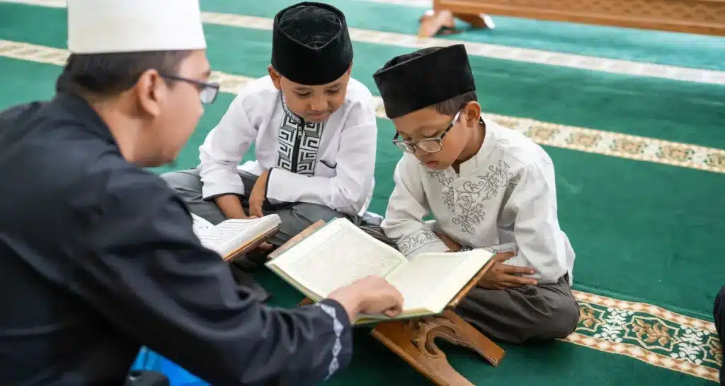 Children learning the Quran inside mosque during a religious class.